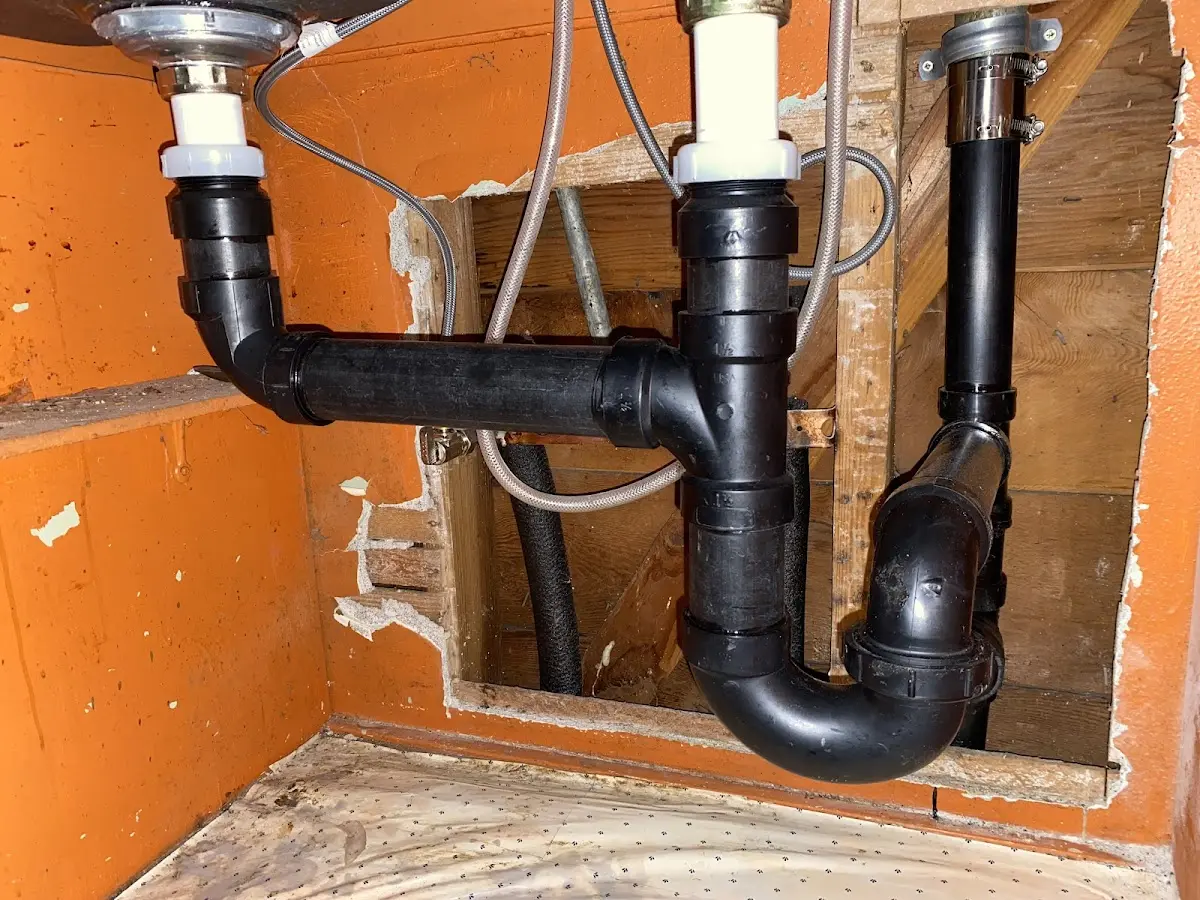 Professional Garbage Disposal Repair equipment and tools on the job in Northgate